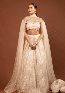 Celestia: Embellished Ivory Cape Lehenga Set